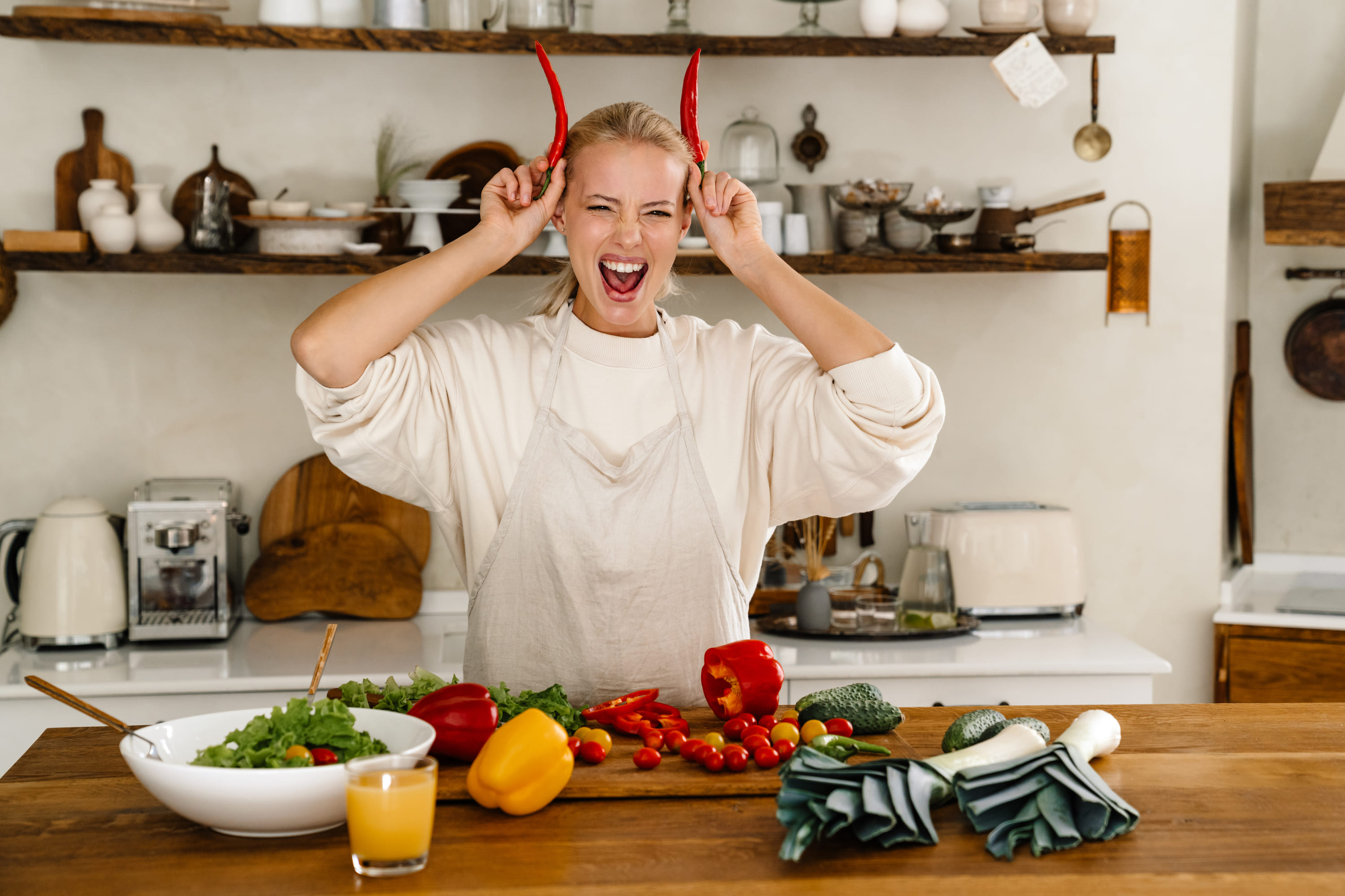 beautiful-excited-woman-making-fun-with-vegetables-2025-02-15-21-05-28-utc (2) (1)