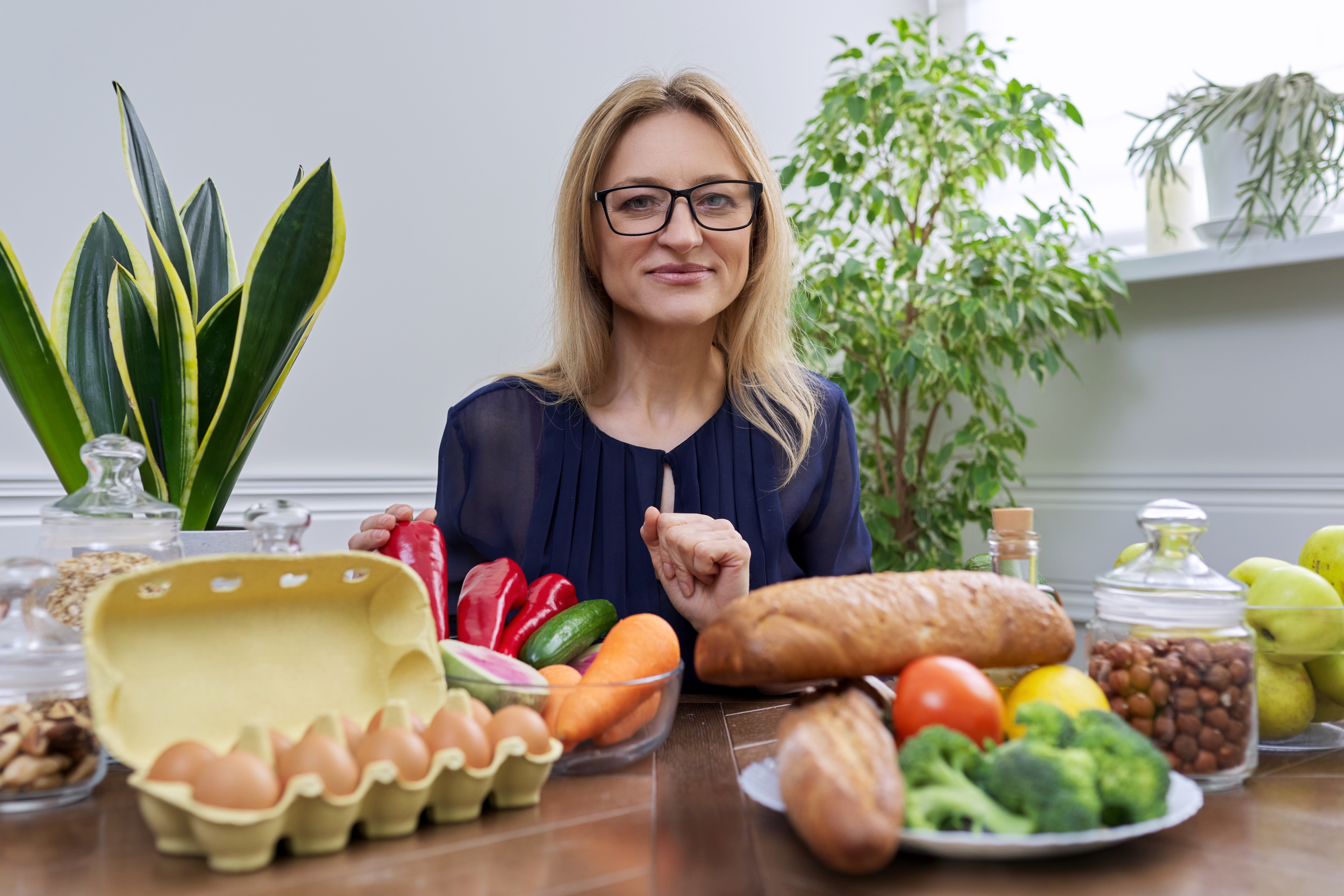 smiling-female-nutritionist-looking-at-camera-with-2024-12-08-03-22-08-utc